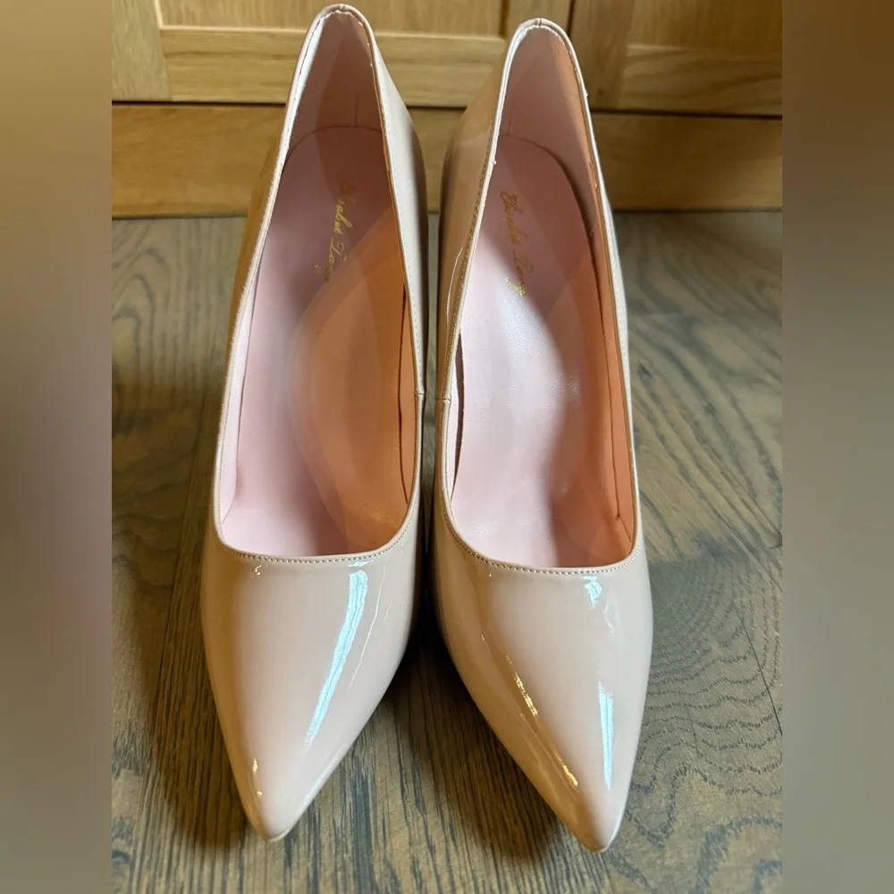 Worn once Elizabet Lang classic statement nude patent leather 4 inch heel shoes.